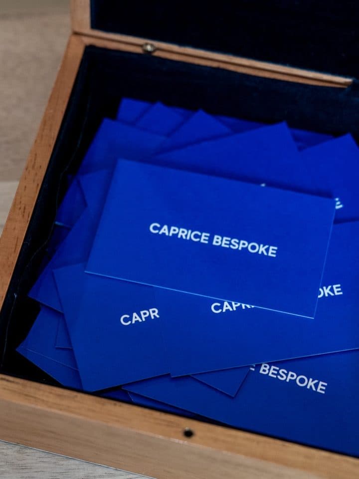 A partner brand's reward cards in a wooden box.