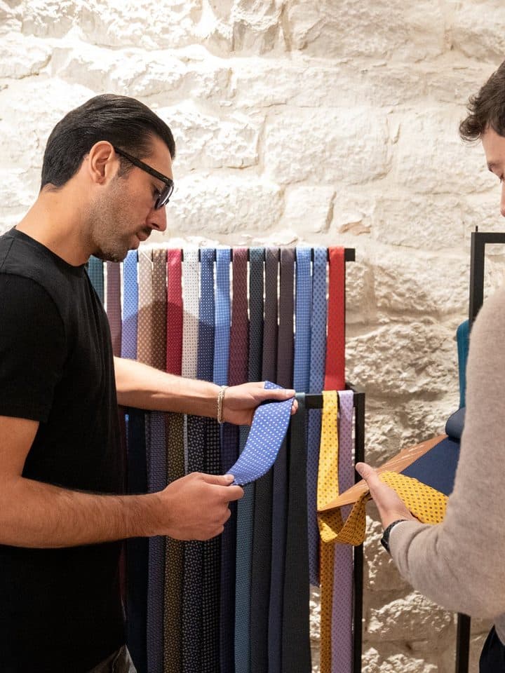 A shopper choosing in store: the same passport works online and at the counter.